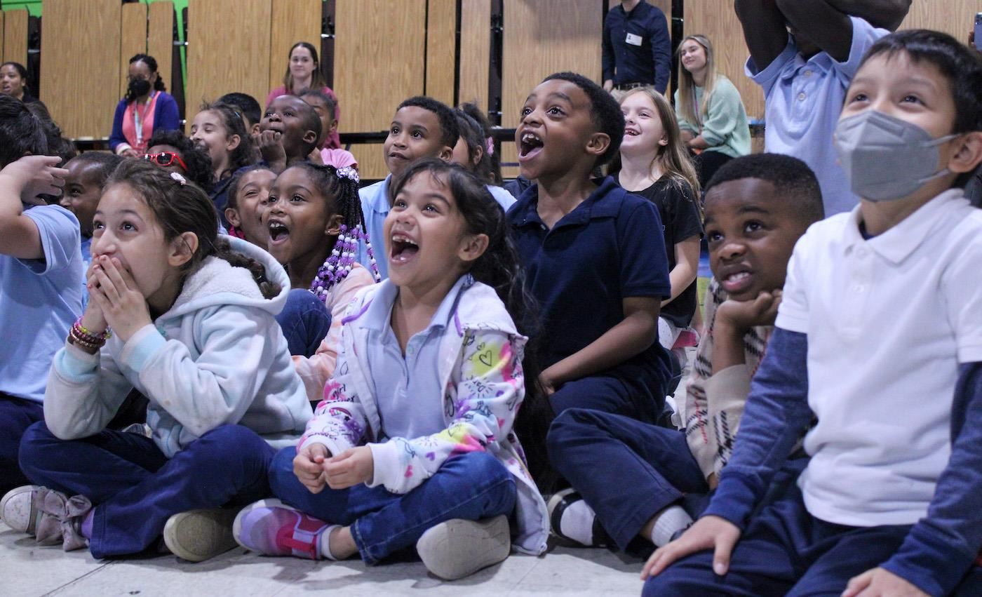 Students watching drones with excitement